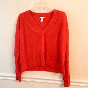 Reddish orange long sleeve sweater
